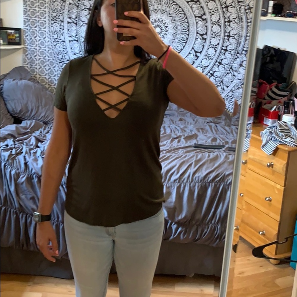 Green shirt with crisscrossing
